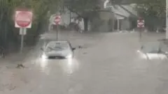 Flash flooding interrupts half-marathon, submerges cars — BBC World